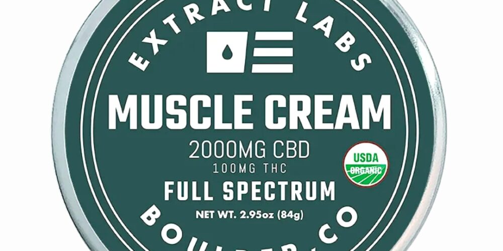 A container of Extract Labs CBD Muscle Cream, on a clear background