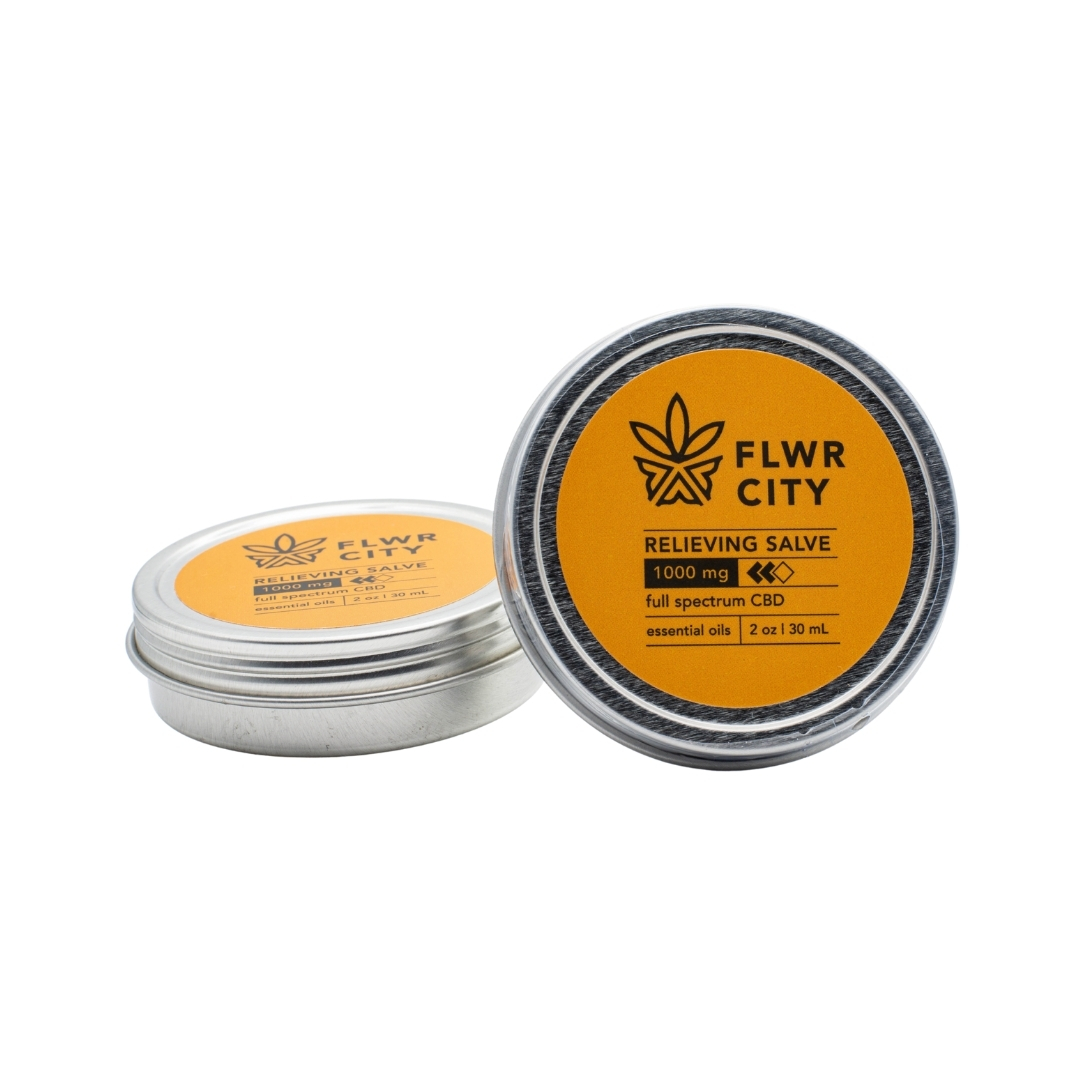 Two tins of FLWR CITY CBD Relieving Salve on a white background