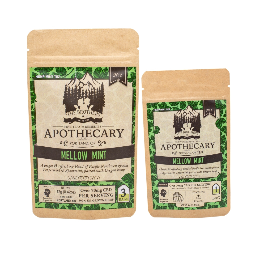 Two packets of The Brothers Apothecary's Mellow Mint tea, one large and one small, on a white background