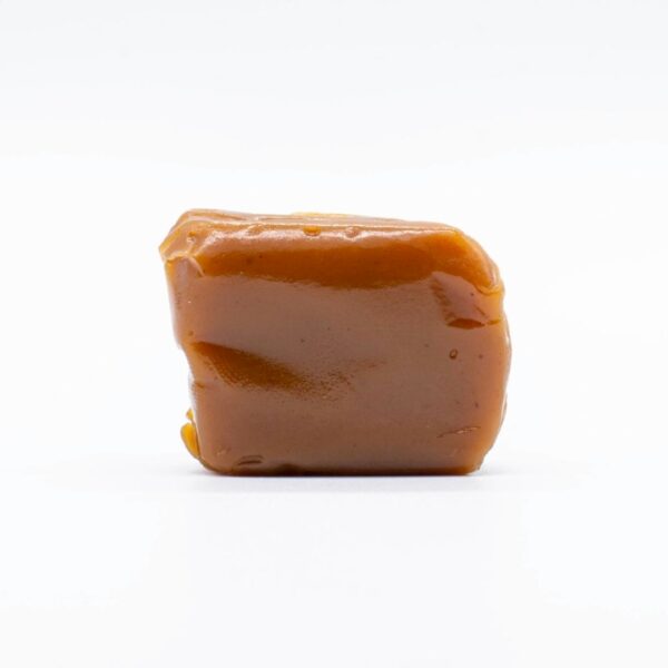 One piece of Seventh Hill CBD's CBN Chill Caramel on a white background