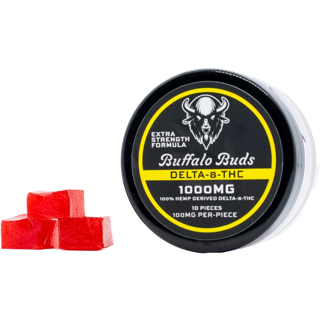 A container of Extra Strength Buffalo Buds, next to a stack of the Buffalo Buds gummies, on a white background