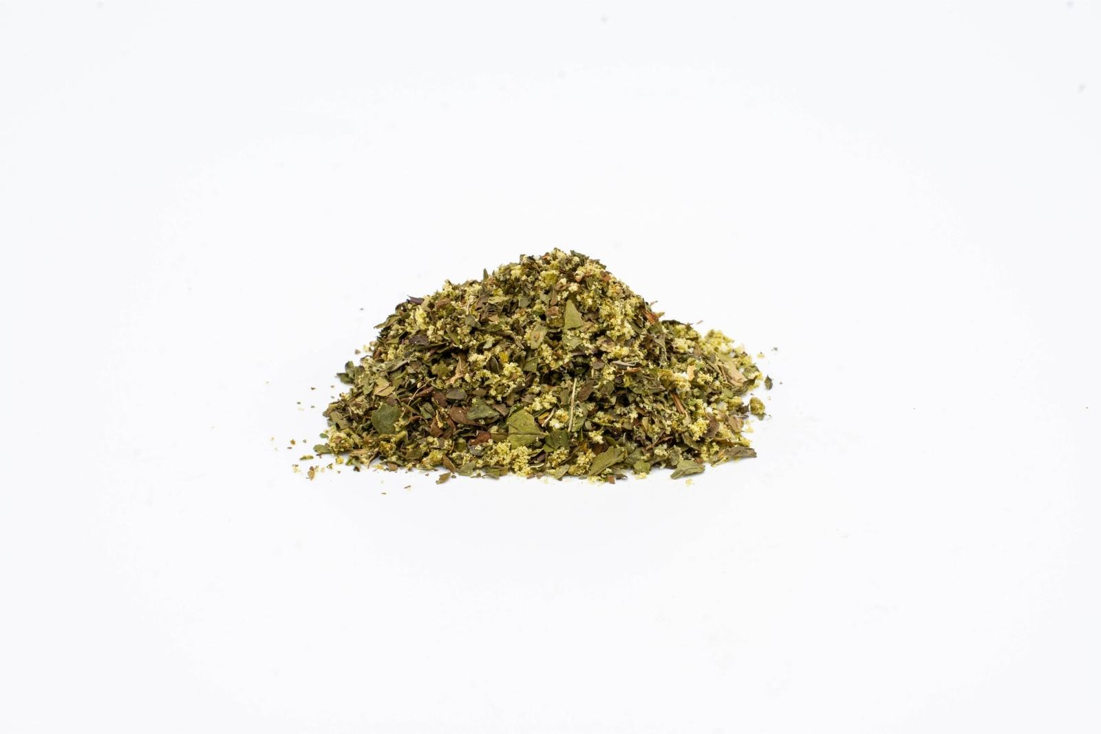 A pile of loose Mellow Mint tea by The Brothers Apothecary on a white background