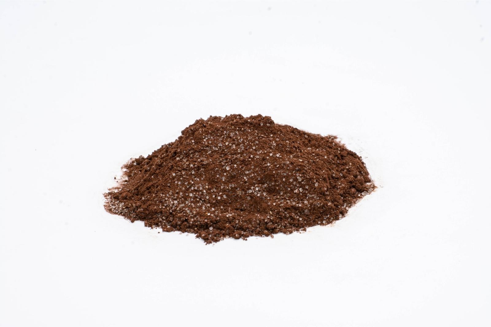 A pile of loose Peppermint Treat CBD Cocoa mix by The Brothers Apothecary, on a white background