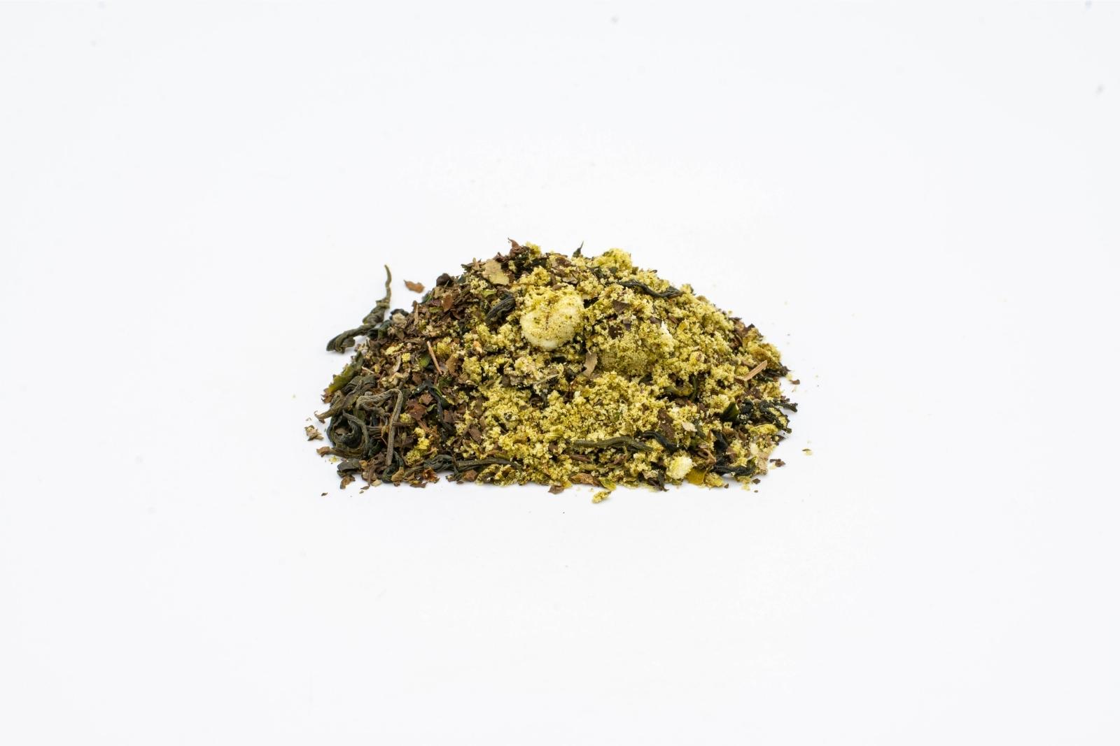 A pile of loose Buddha's Berry tea by The Brothers Apothecary on a white background