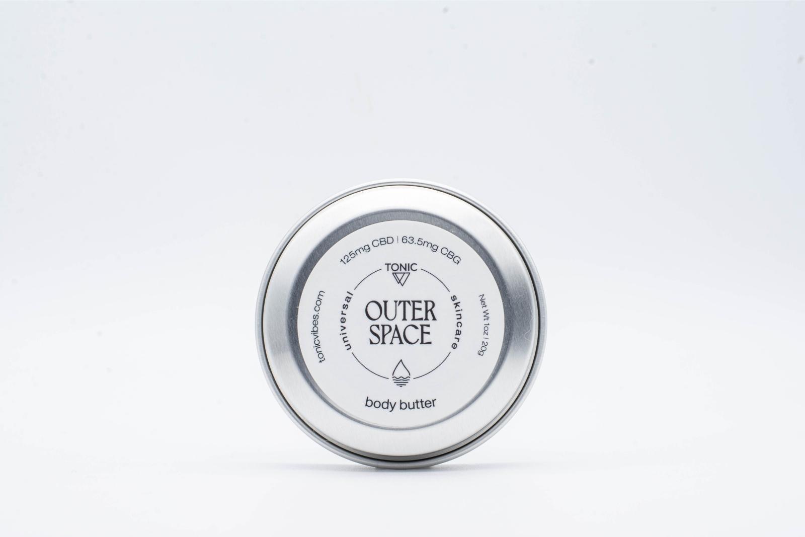 One small can of Tonic's Outer Space CBD + CBG body butter, on a white background