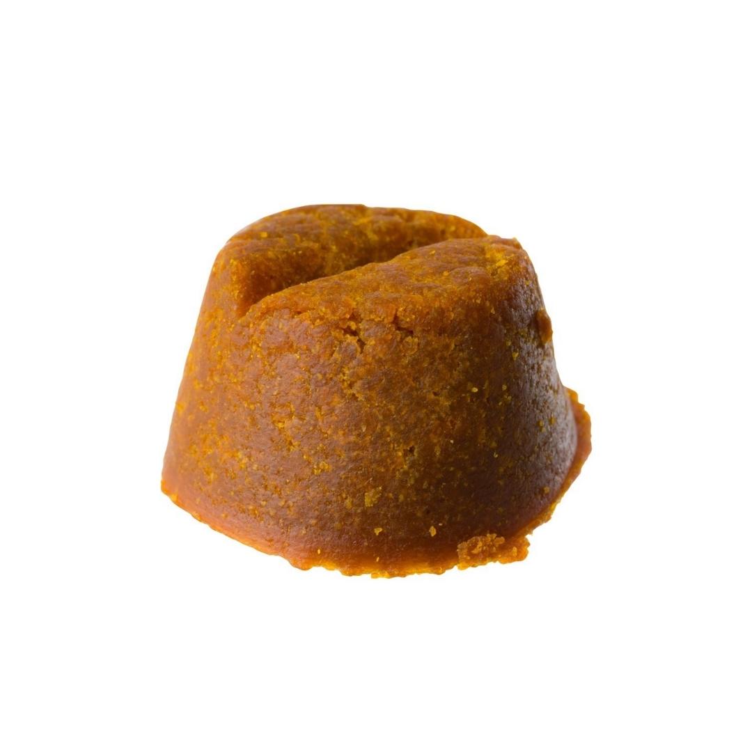 One single Calm + Digestion CBD Dog Treat by Lazarus Naturals on a white background.