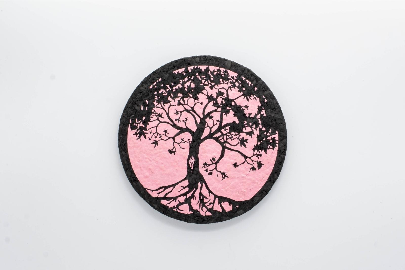 A pink Tree of Life rubber dab mat from East Coasters, on a white background