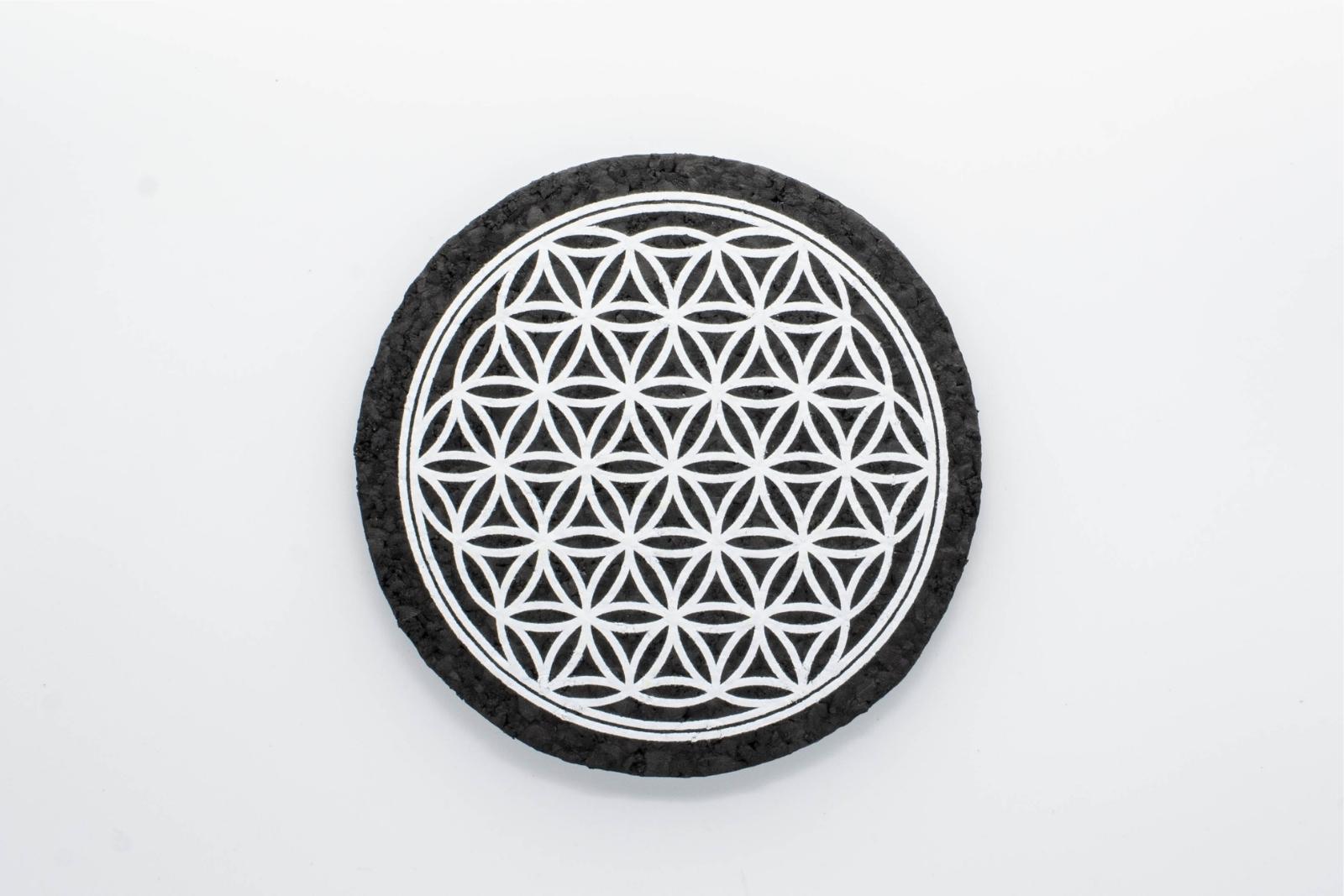 A white Flower of Life rubber dab mat from East Coasters, on a white background