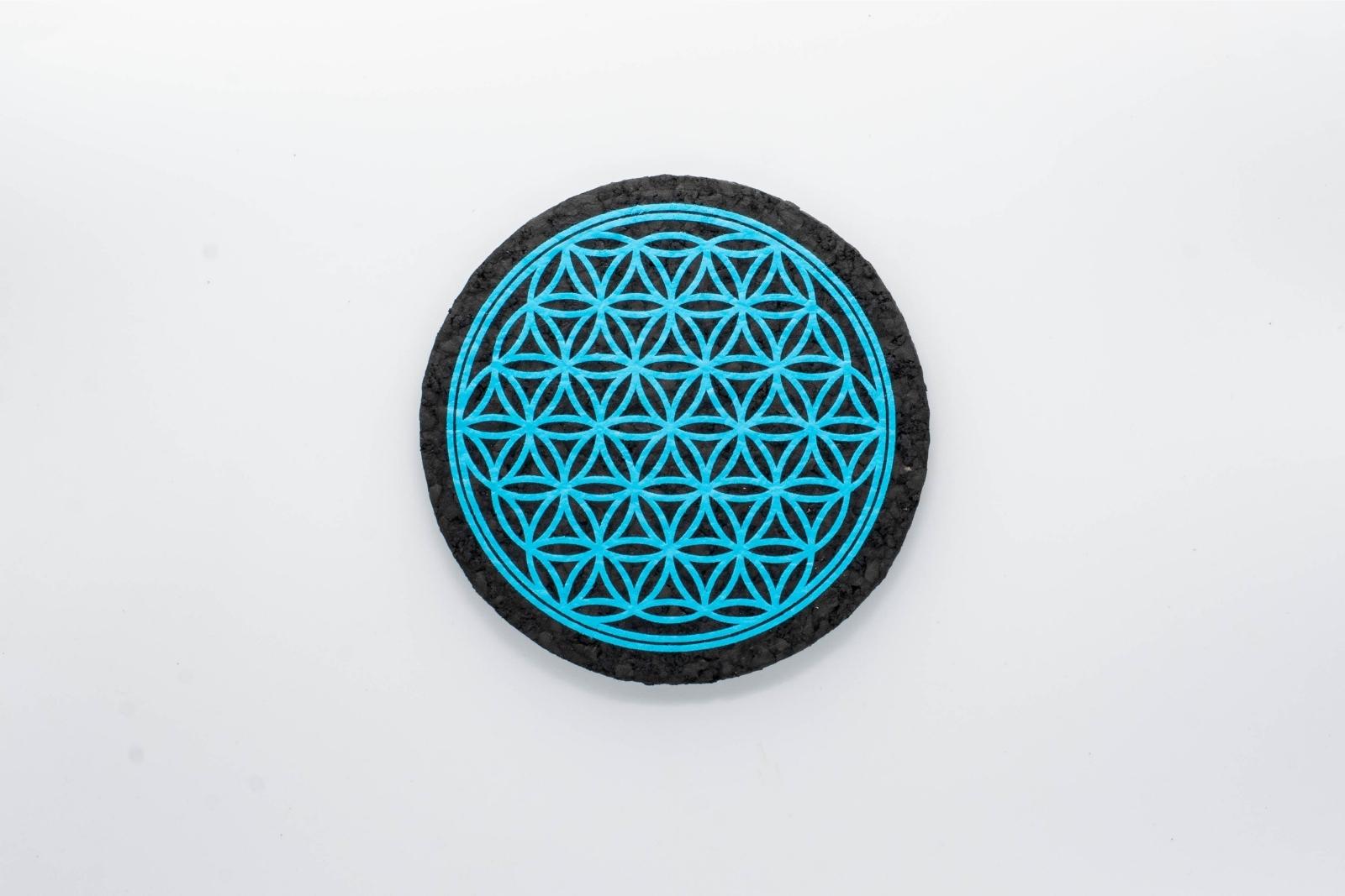 A blue Flower of Life rubber dab mat from East Coasters, on a white background