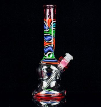 A royal jelly, 8-inch glass rig made by Bradfurd Glass, on a black background