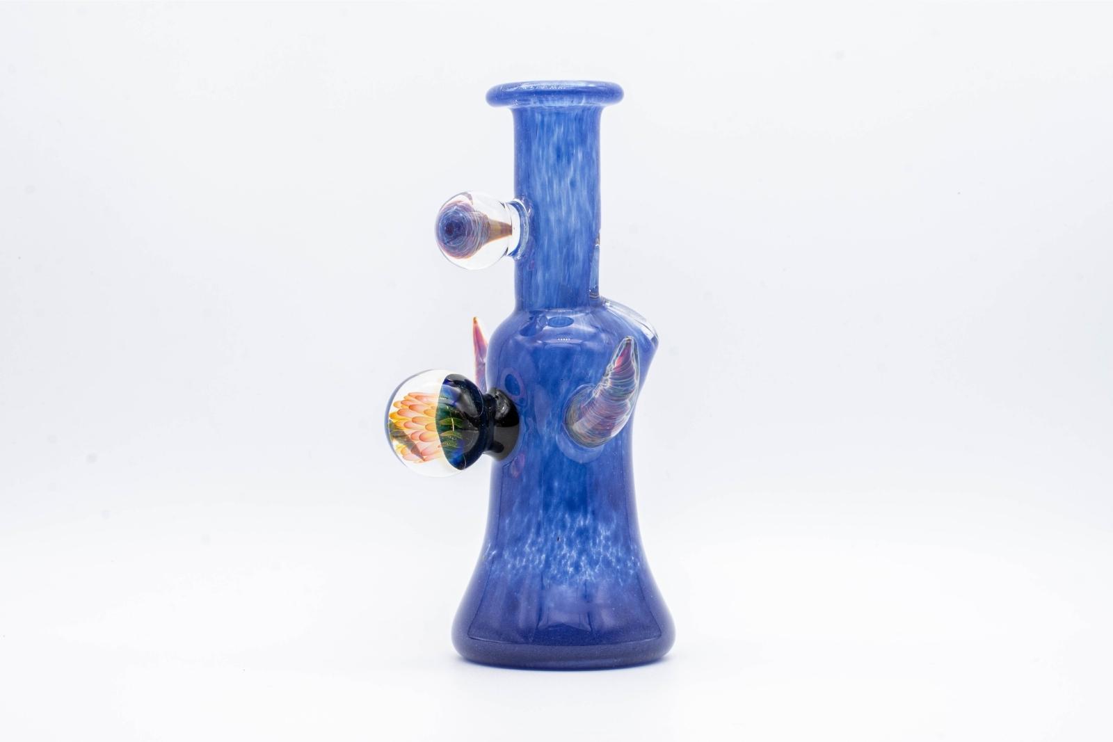 A blue, 6-inch jammer, made by GooMan Glass, on a white background