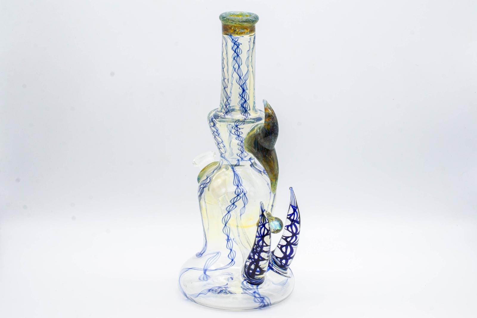 A silver and cobalt 8-inch glass rig, made by Bradfurd Glass, on a white background