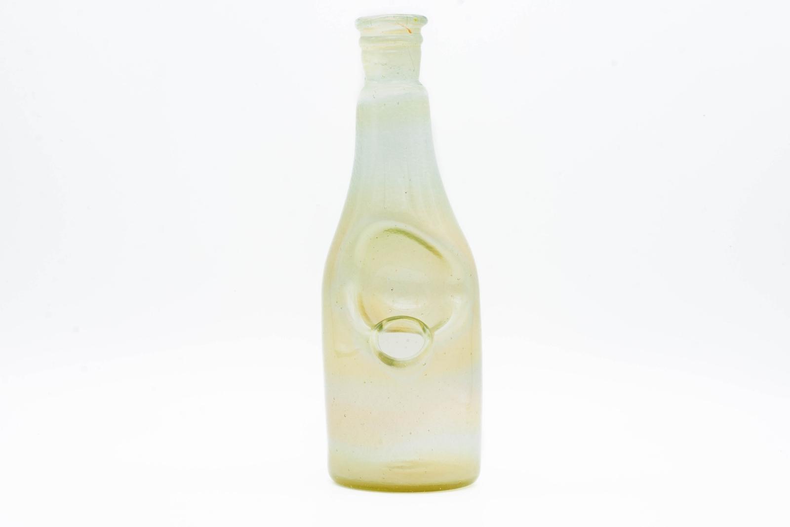 A satin sake bottle rig by Costa Glass, on a white background