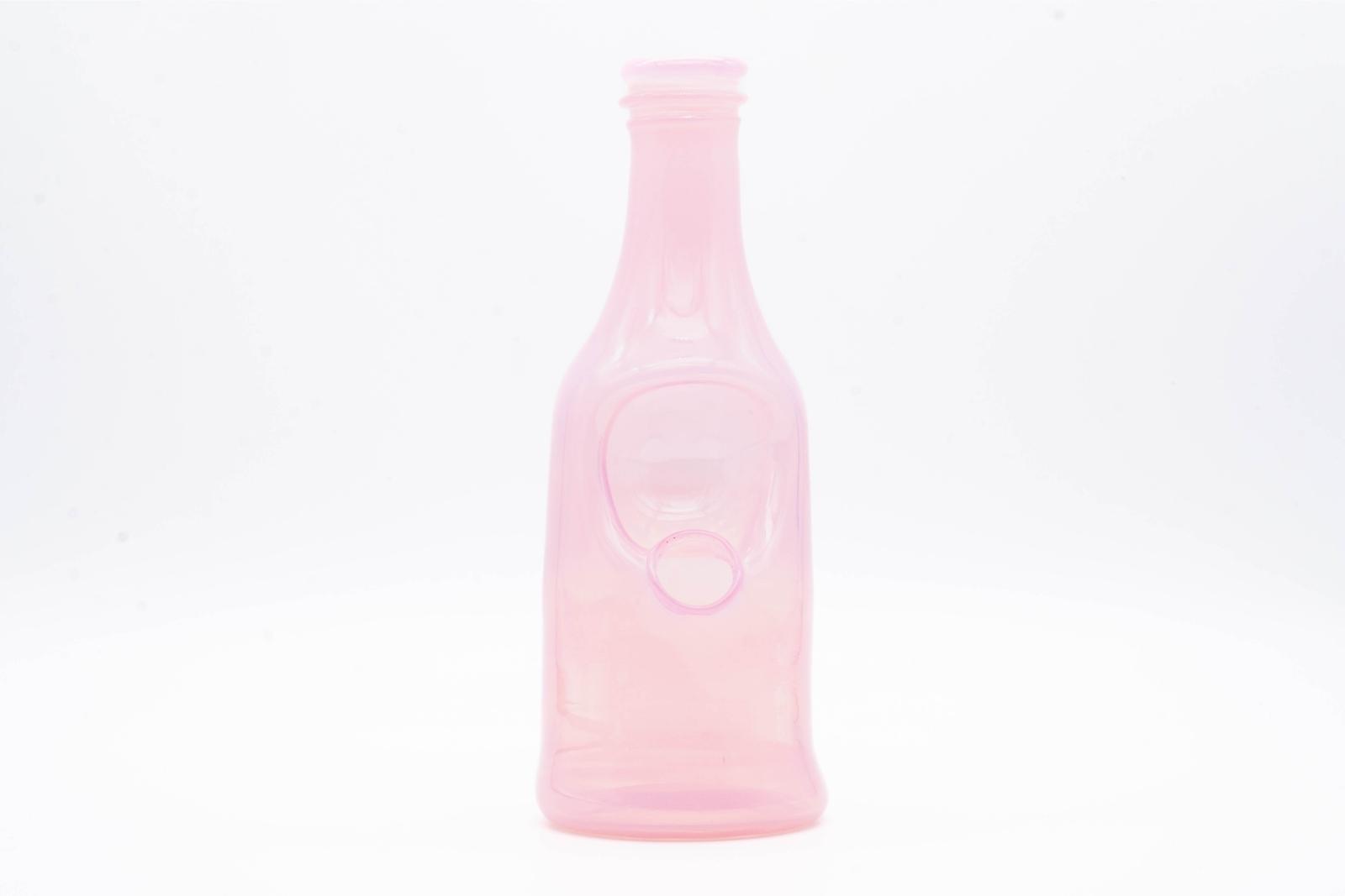 A pink sake bottle rig by Costa Glass, on a white background