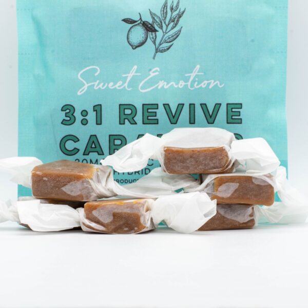 A 6 pack, next to a pile of Seventh Hill CBD's 3:1 Revive Caramel on a clear background