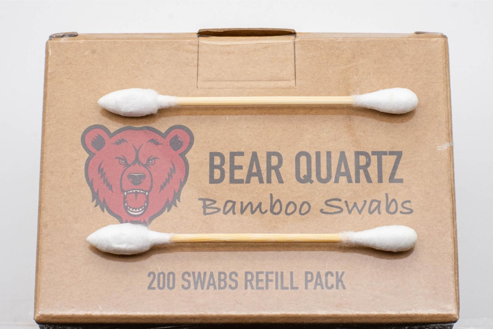 A BQ Bamboo Refill box, with two cotton swabs laid on top of the box, on a white background
