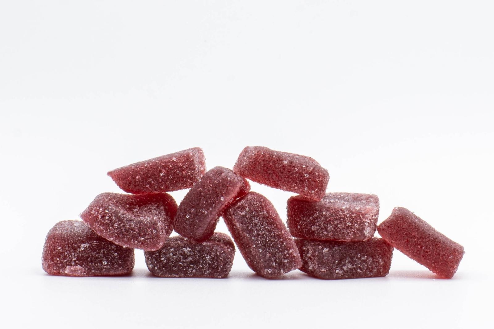 A group of Huckleberry CBD gummies by Cycling Frog, on a white background