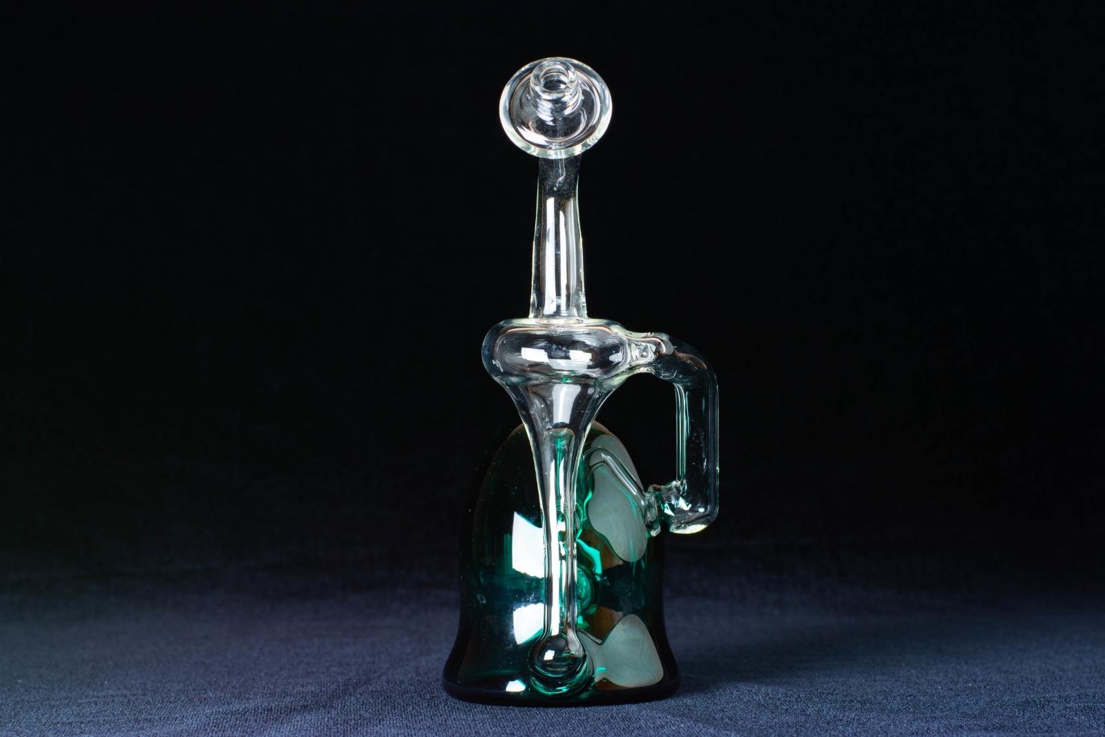 A green 8-inch recycler made by Jack Glass Co., on a black background