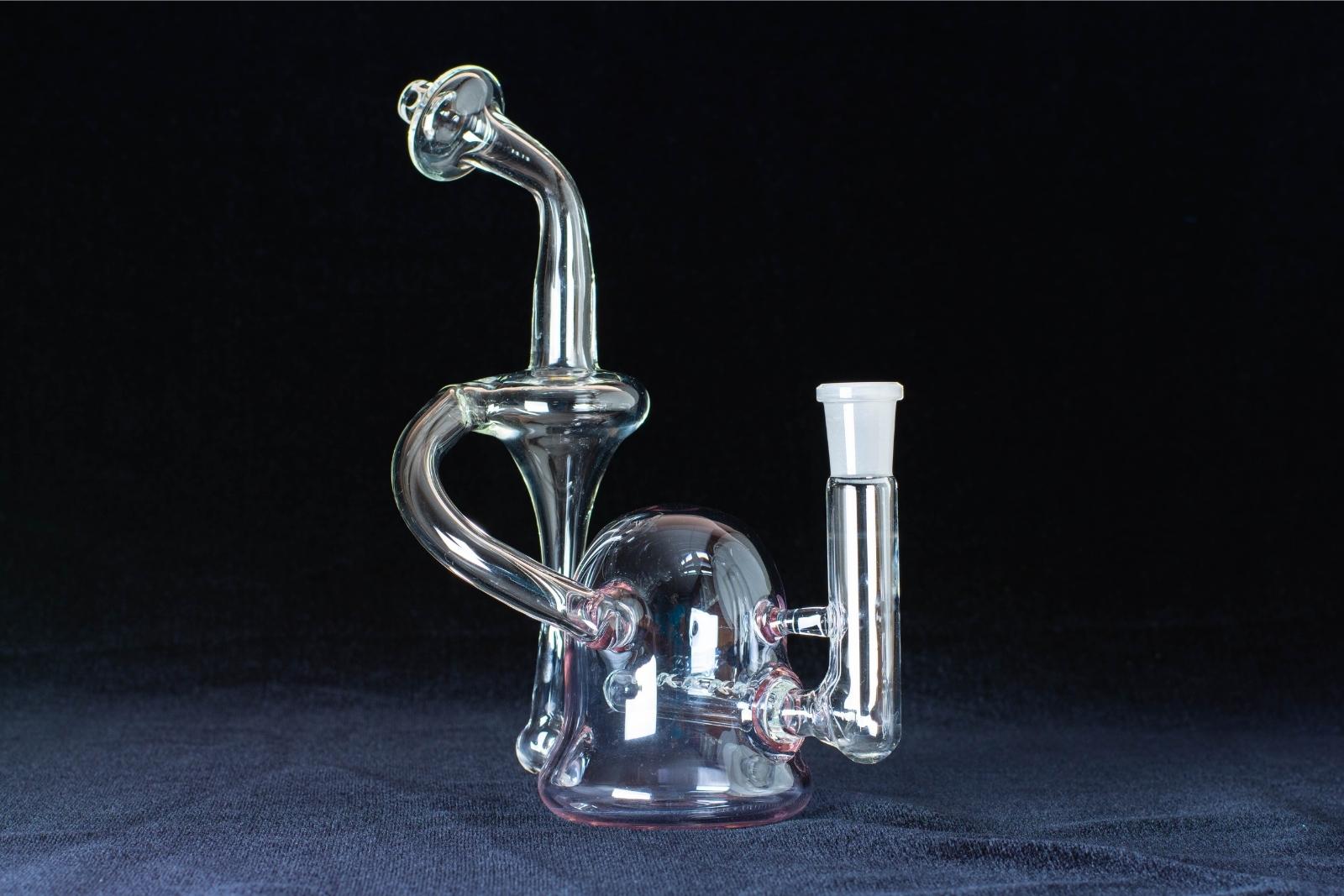 A lilac 8-inch recycler made by Jack Glass Co., on a black background