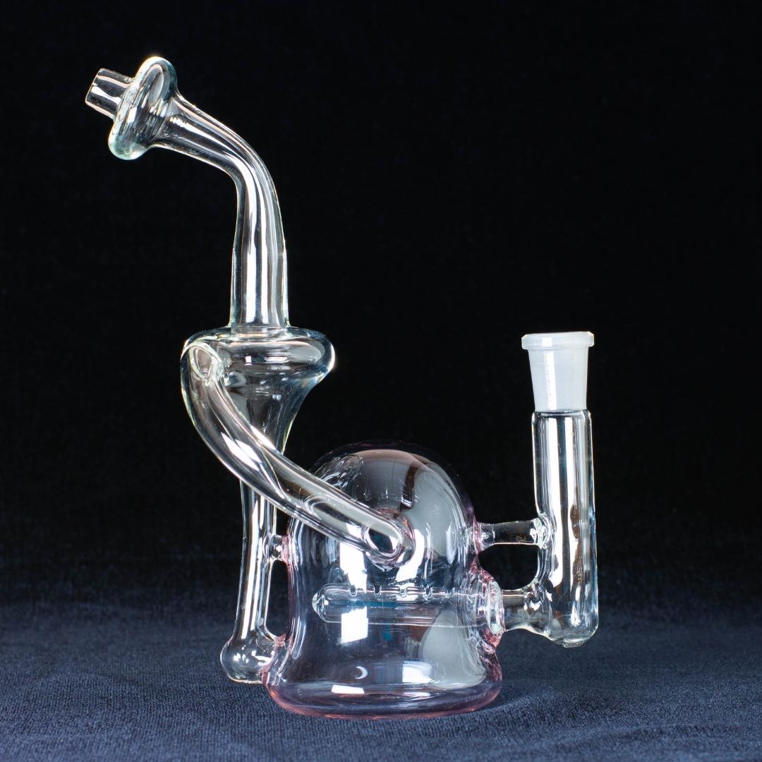 A lilac 8-inch recycler made by Jack Glass Co., on a black background