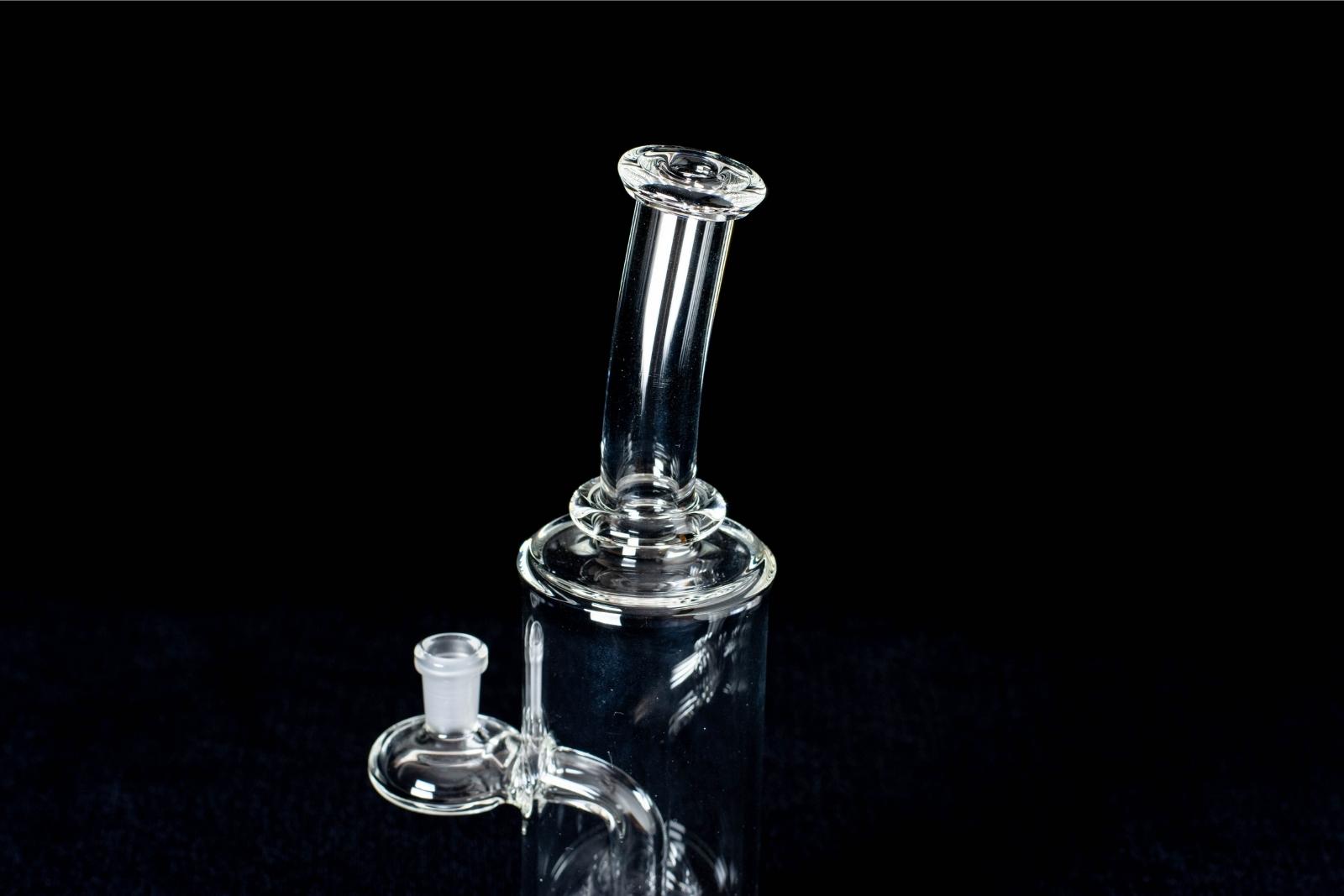 A clear, 7-inch banger hanger, made by BorOregon, on a black background