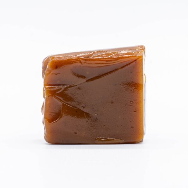 An unwrapped 3:1 Revive Caramel by Seventh Hill CBD, on a white background