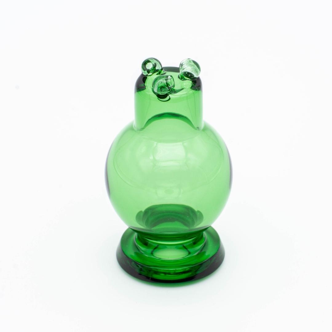 A clear green spinner bubble cap made by BorOregon, on a white background