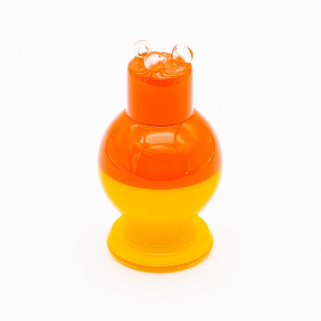 A red and yellow spinner bubble cap made by BorOregon, on a white background