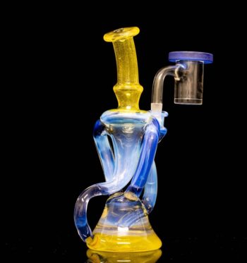 A blue and yellow dual recycler by Quasi Glass, on a black background