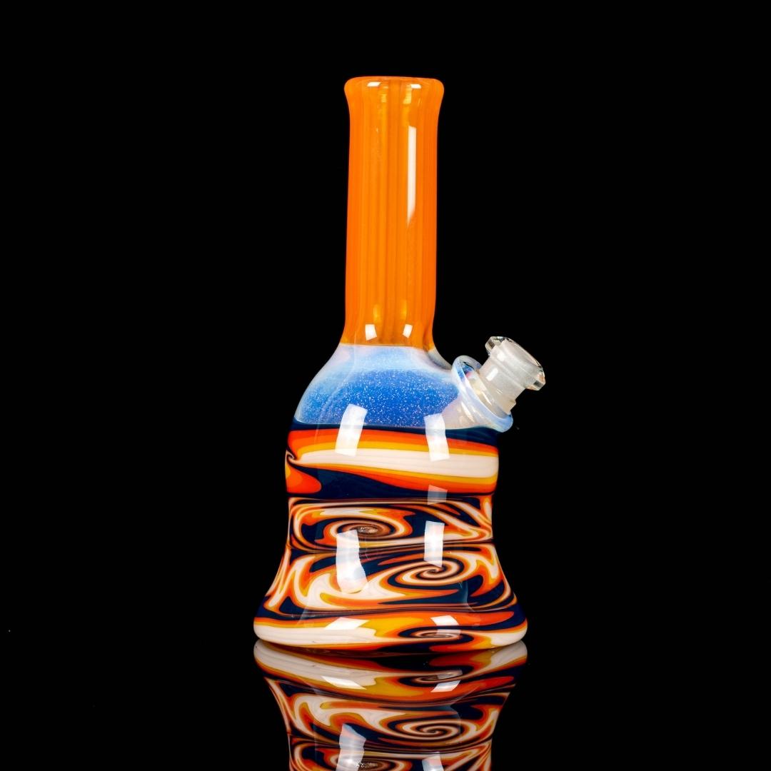 A tangie 6-inch glass rig made by Bradfurd Glass, on a black background