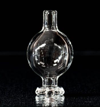 A clear bubble cap, made by BorOregon, on a black background