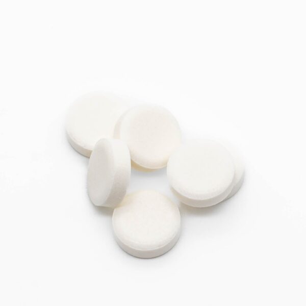 A small pile of Wintergreen THC Mints, on a white background