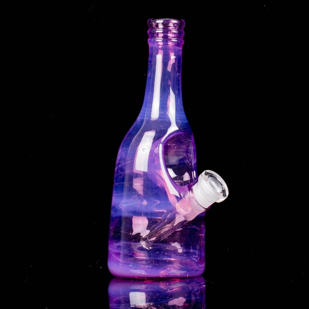 A purple sake bottle rig by Costa Glass, on a black background