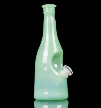 A seafoam green sake bottle rig by Costa Glass, on a black background