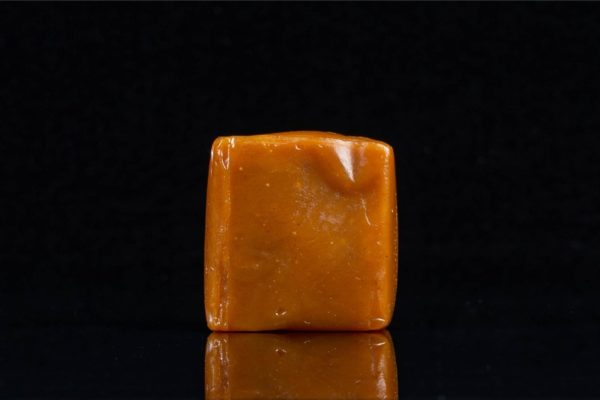 One 1:1 Pumpkin Spice caramel by Seventh Hill CBD on a white background