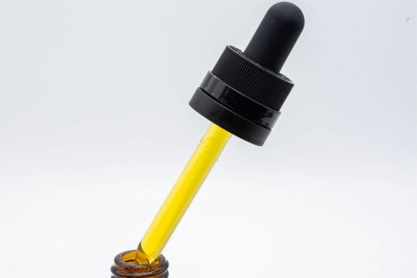 A dropper of Seventh Hill CBD's 6:1 Balance Oil on a white background