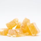 A pile of Indica Gummies by Seventh Hill CBD, on a white background