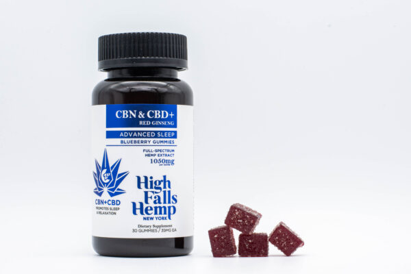 One container and one packet of High Falls Hemp Advanced Sleep gummies on a clear background
