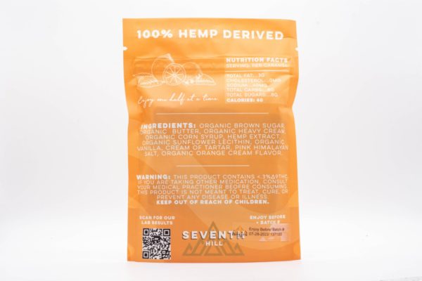 The backside of a bag of 3:1 Orange Cream Caramels by Seventh Hill CBD, on a white background.