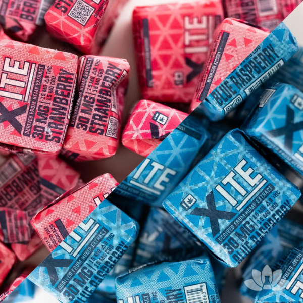 A split screen image between a pile of Strawberry Xite 1:1 Fruit Chews and a pile of Blue Raspberry Fruit Chews