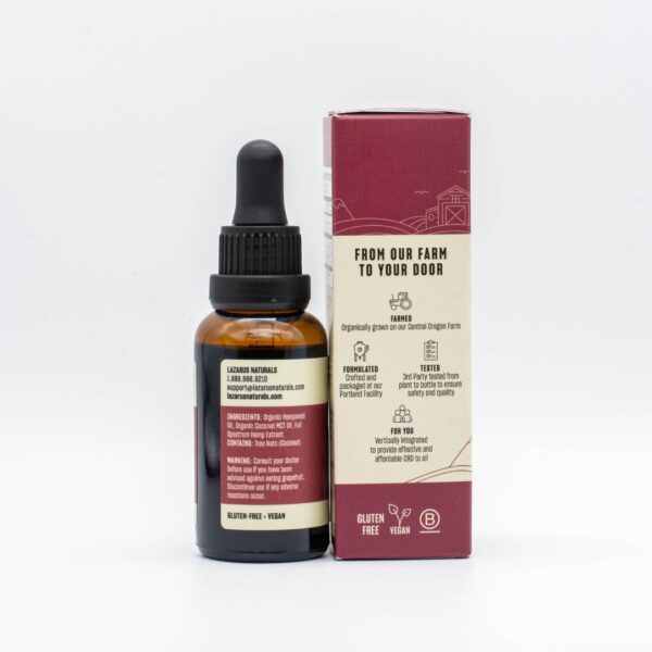The backside of a tincture of Lazarus Naturals High Potency Sleep Oil, next to its box, on a white background