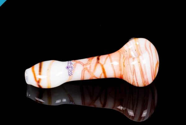 A side shot of Sqwash Glass Spin Spoon D on a black background