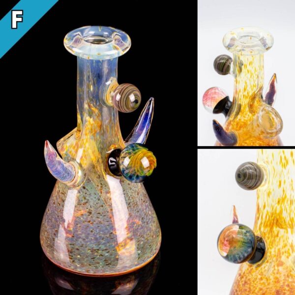 Three photos of a gold jammer by Gooman Glass, on a white background and a black background