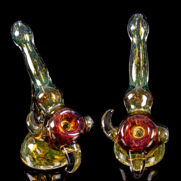 A Paul Taylor Glass Thick Frit Bubbler, showing two different angles, on a black background