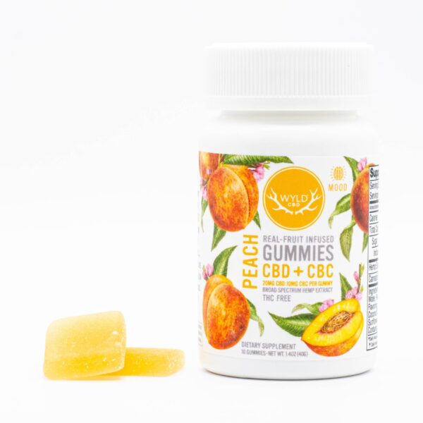 A 40-count bottle of Wyld CBD + CBC Peach Gummies, next to two of the gummies, on a white background.