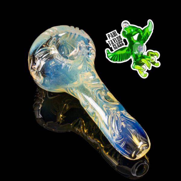 A Paul Taylor Glass Carved Basic Fume Spoon, on a black background.