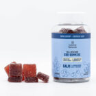 A 40-count of Lazarus Naturals CBD Calm Gummies, next to a pile of the gummies, on a white background.
