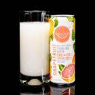 A can of WYLD Grapefruit CBD Sparkling Water next to a glass with the Blackberry water poured into it. Both are on a black background