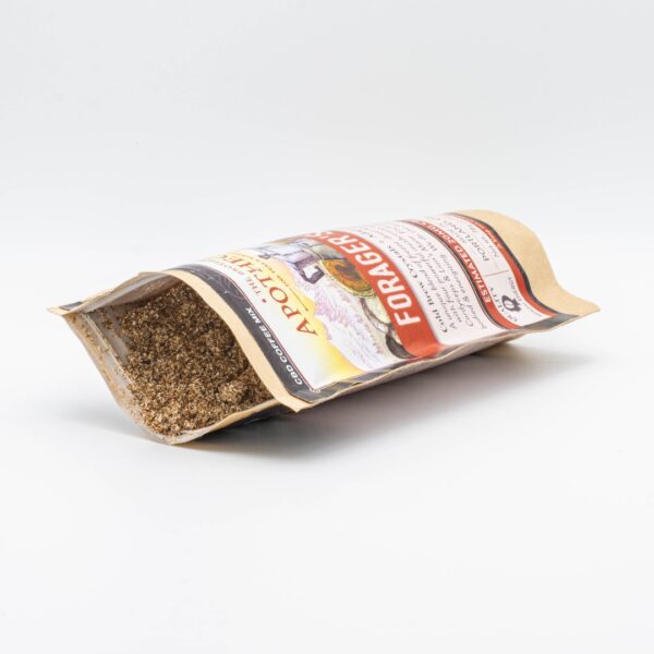One bag of Forager's Java CBD Mushroom Instant Coffee, opened and set on its side to show the contents, on a white background