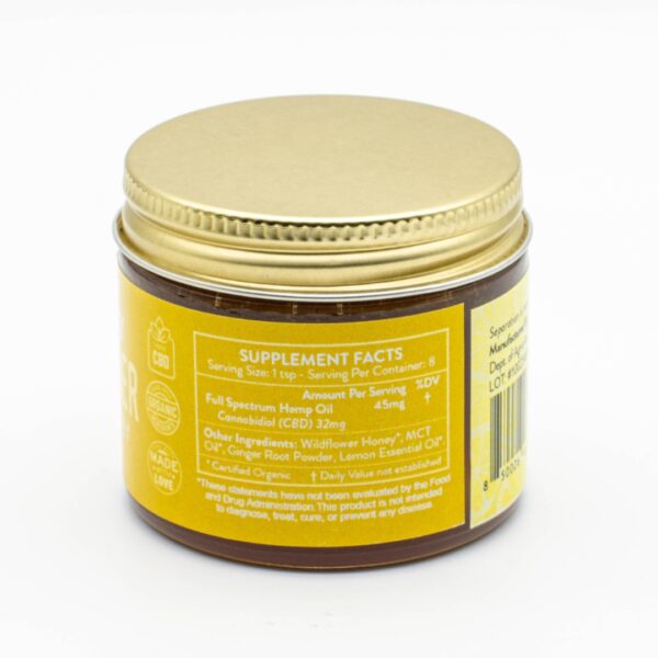 A jar of Lemon Ginger - CBD Honey by The Brothers Apothecary, on a white background